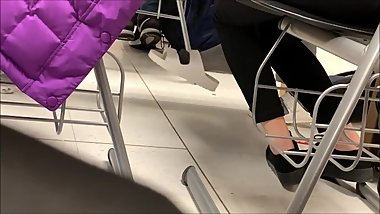 Candid white birkenstock dangling