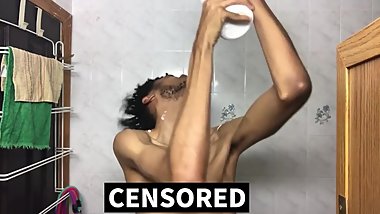 Slim Ebony Male Applies Lotion Liberally