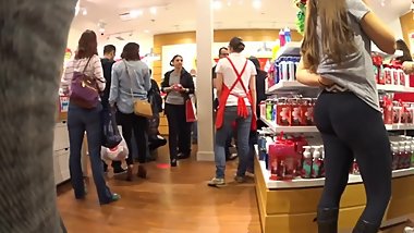 Candid sexy brunette in black leggings with boots
